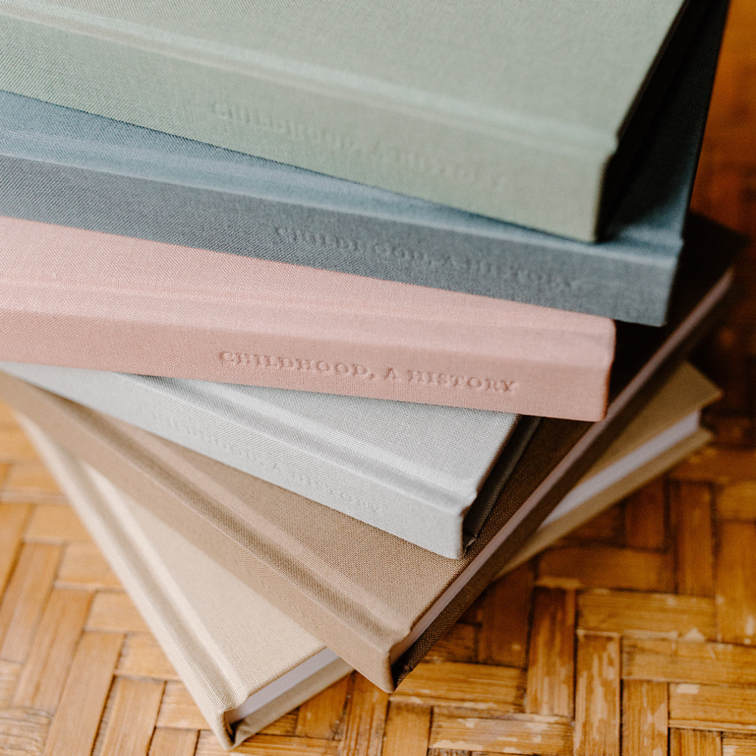 Six Kept books, stacked