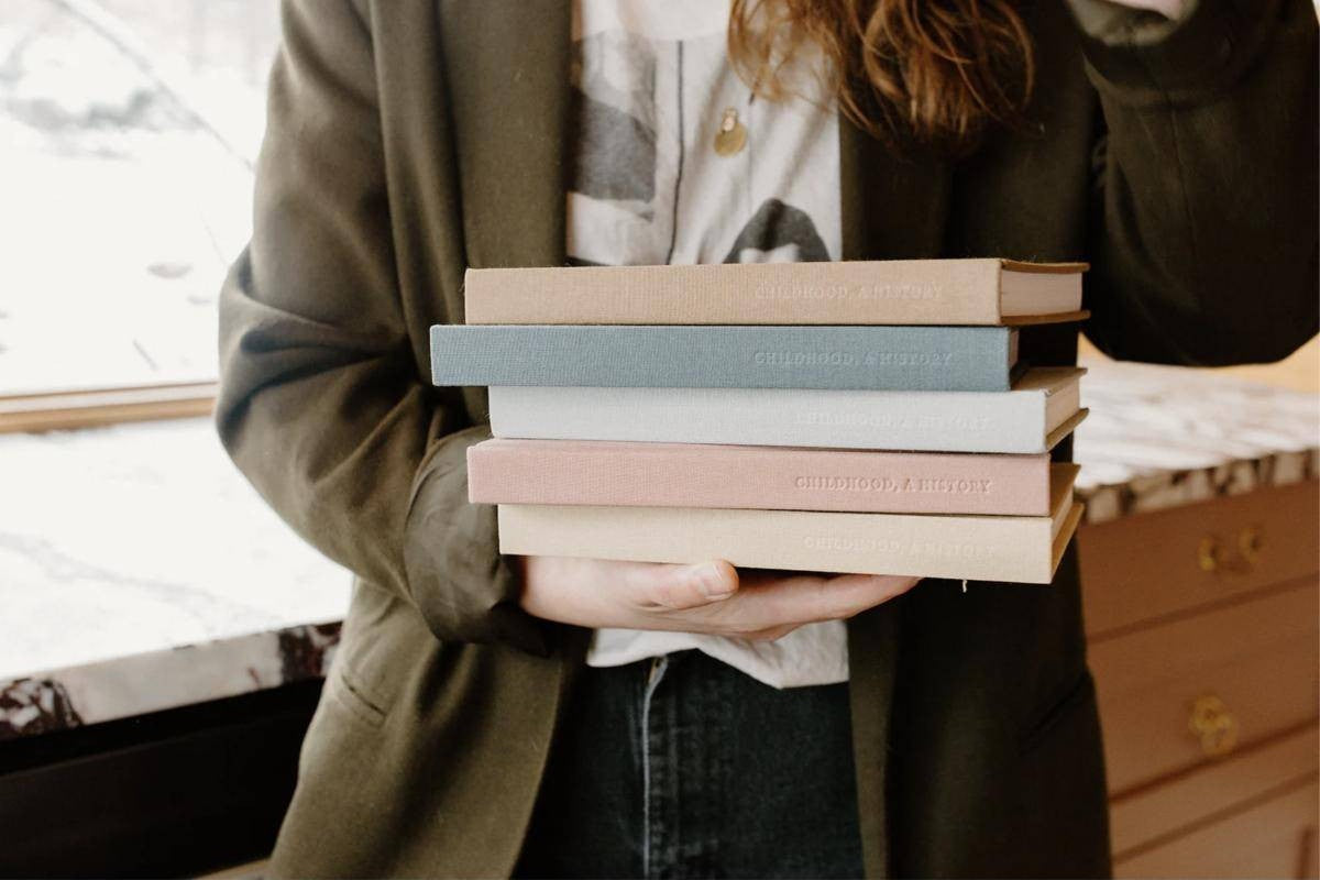 Three Kept books in linen covers